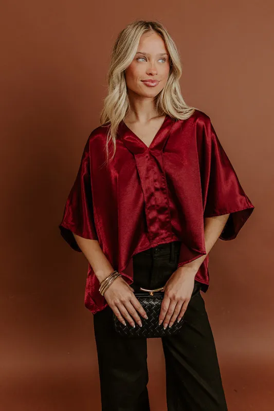 High Society Chic Satin Top in Wine sold by Impressions