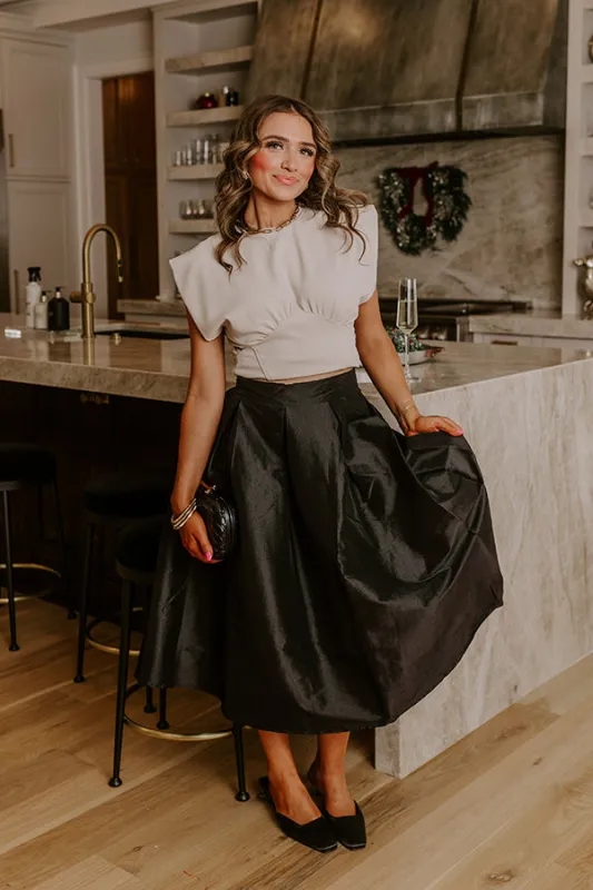 The Belle High Waist Midi Skirt in Black sold by Impressions