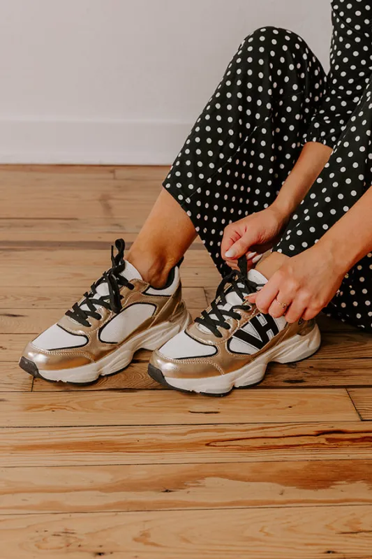 The Dash Faux Leather Sneaker in Gold sold by Impressions