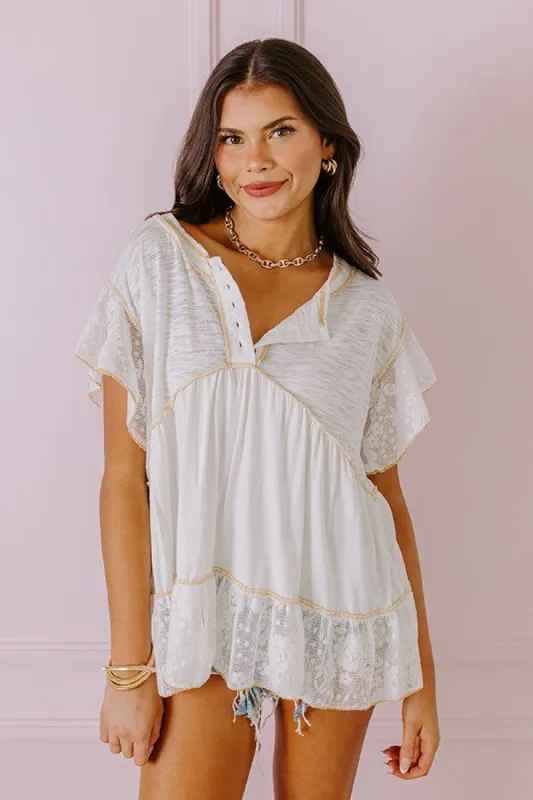 Springtime Sips Lace Babydoll Top In White sold by Impressions