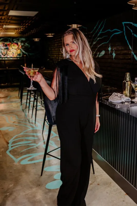 Luxury Excursions Jumpsuit in Black Curves sold by Impressions