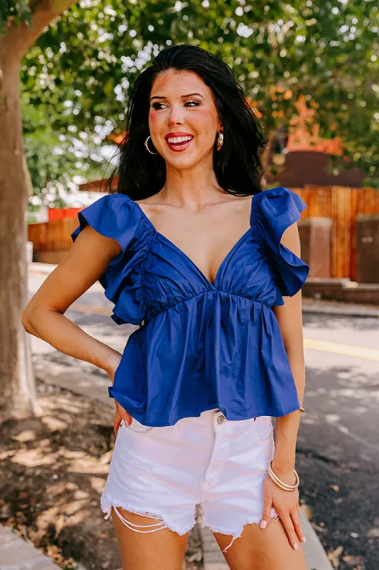 Stay Here Awhile Peplum Top In Dark Blue sold by Impressions