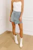 The Tilly Denim Mini Skirt in Light Wash sold by Impressions