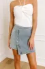 The Tilly Denim Mini Skirt in Light Wash sold by Impressions