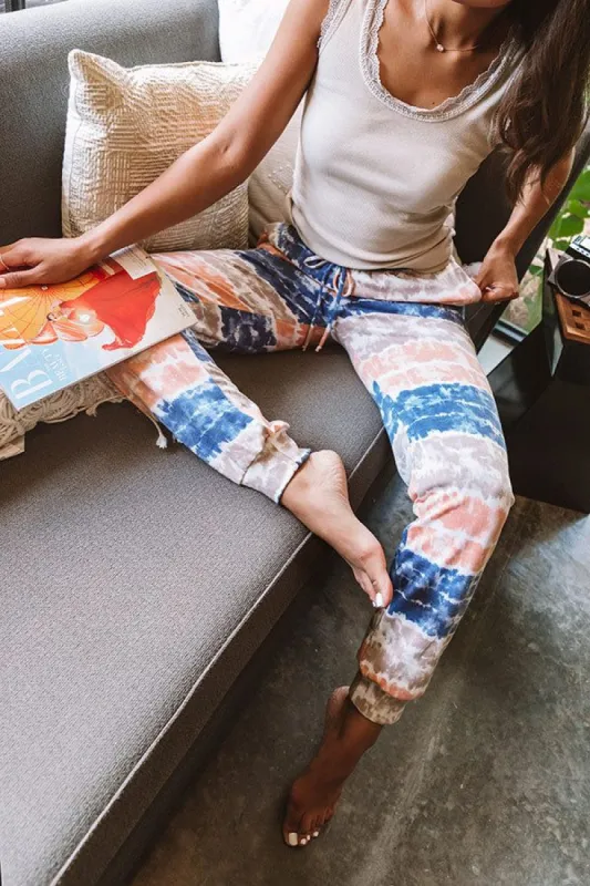 Here And There Tie Dye Joggers In Navy sold by Impressions