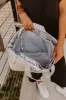 Weekend Getaway Puffer Tote in Silver sold by Impressions
