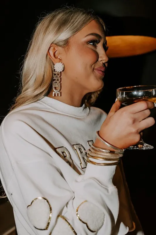 I Am The Bride Earrings In Gold sold by Impressions