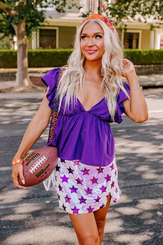 Stay Here Awhile Peplum Top In Purple sold by Impressions