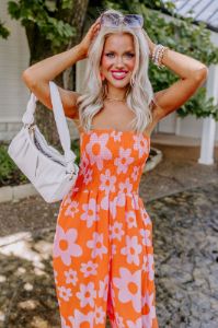 Loft Party Smocked Floral Jumpsuit in Orange sold by Impressions