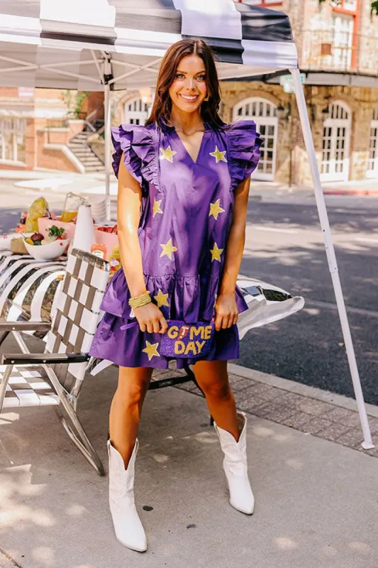 Under The Stadium Lights Ruffle Mini Dress in Purple sold by Impressions