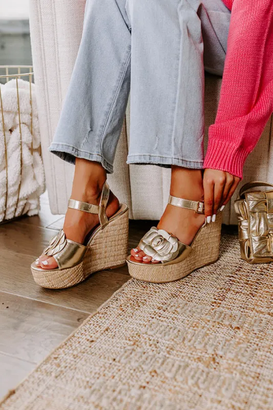 The Flora Metallic Wedge in Gold sold by Impressions