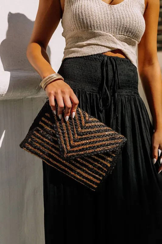 Going For Glam Woven Clutch sold by Impressions