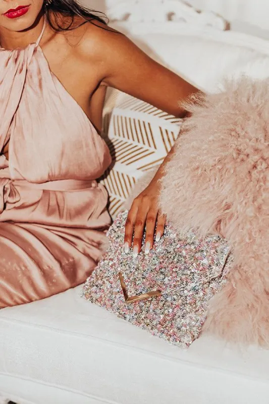 Night Of Sparkles Sequin Clutch In Multi sold by Impressions