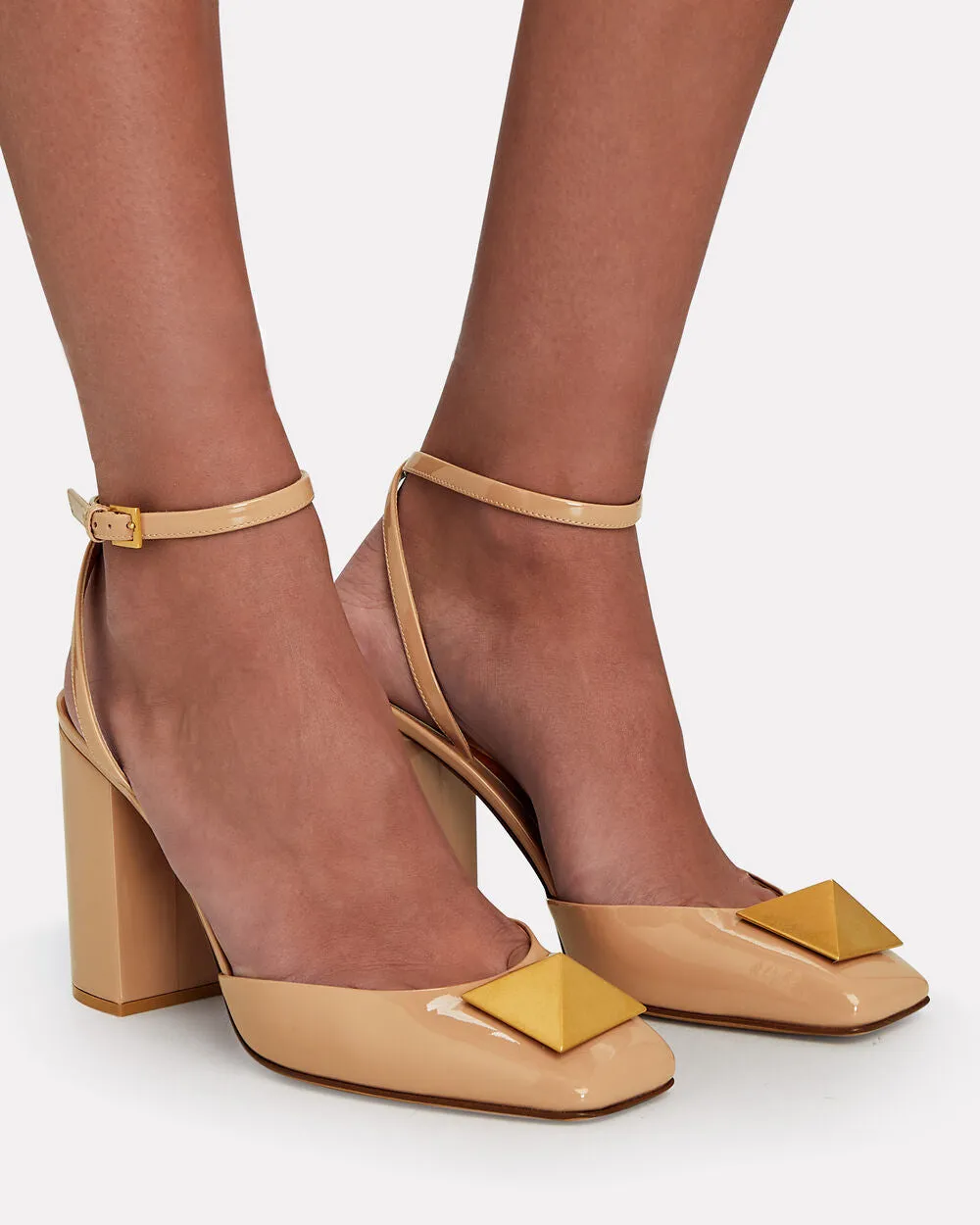 One Stud Patent Leather Pumps sold by INTERMIX