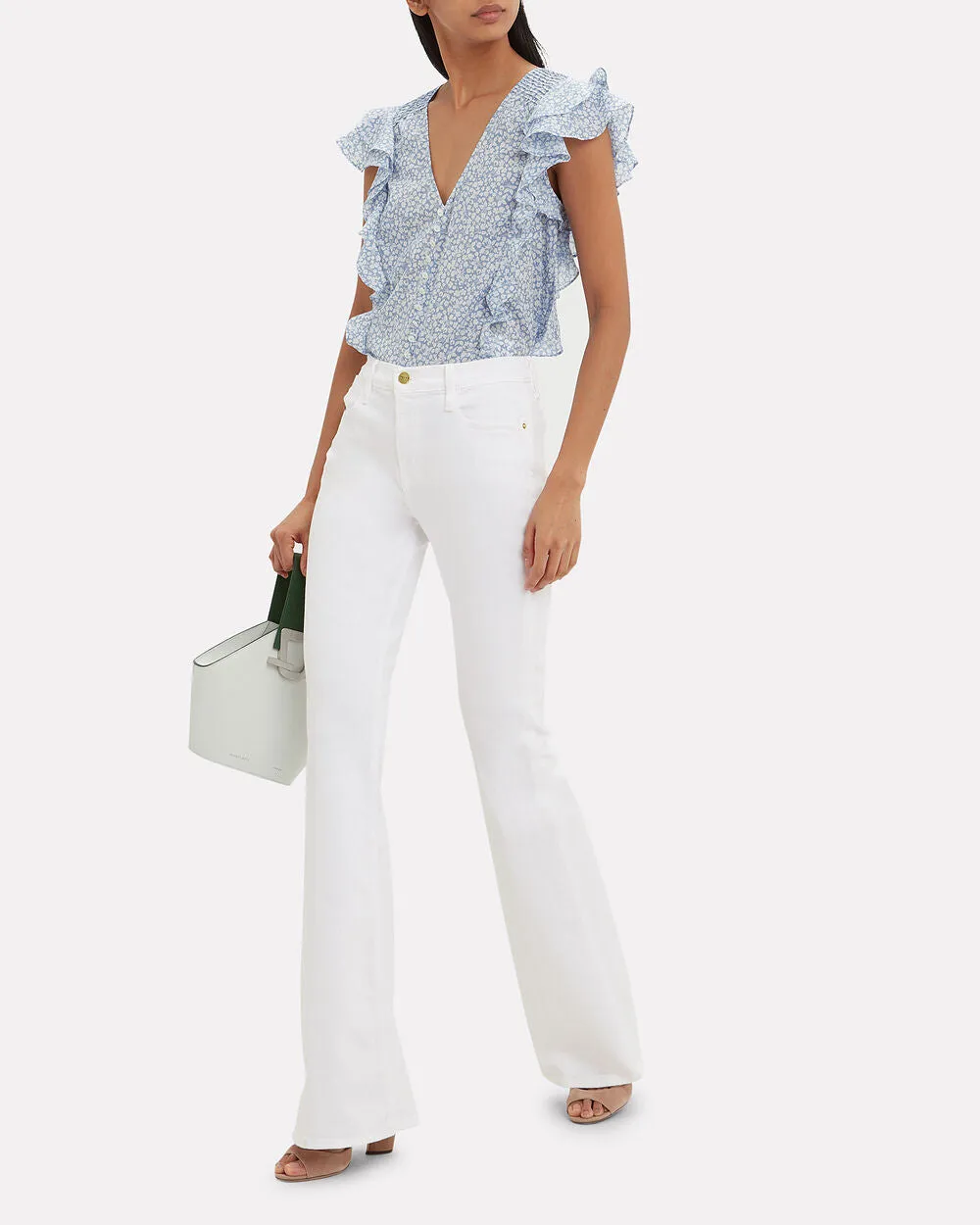 Le High Flare Jeans sold by INTERMIX
