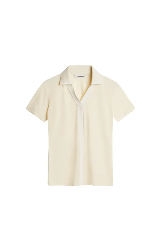 Evia Polo / Lemon Icing sold by J. Lindeberg