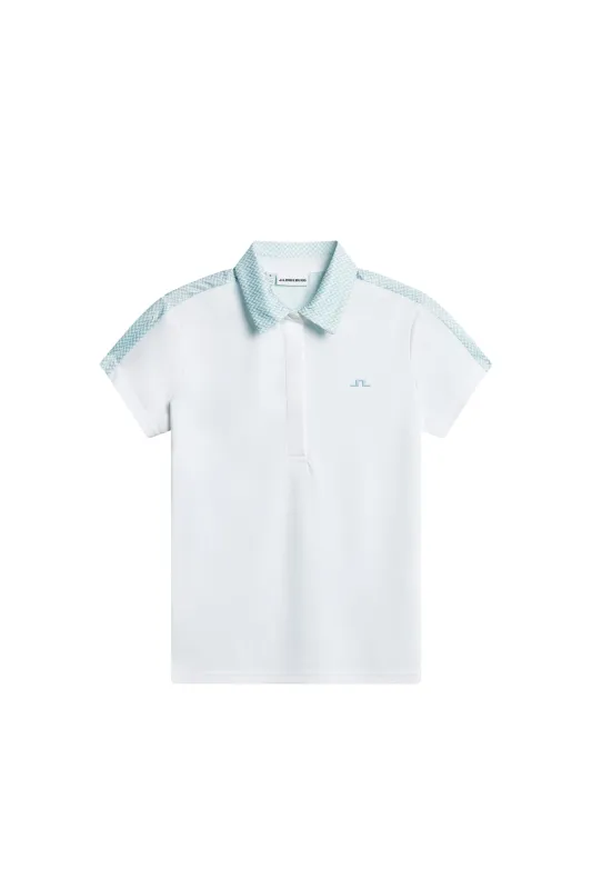 Cara Polo / White sold by J. Lindeberg