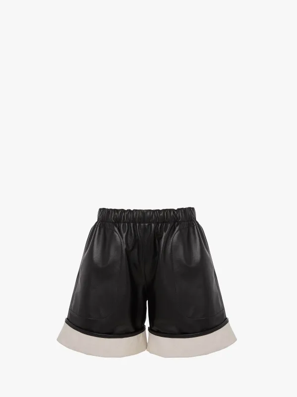 CONTRAST LEATHER HEM SHORTS sold by J.W. Anderson