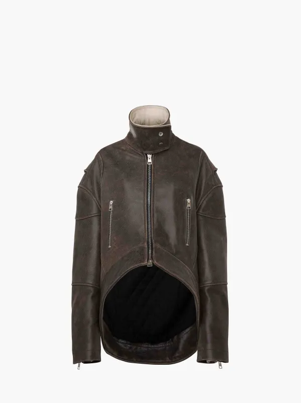 CURVED LEATHER HEM HIGH NECK JACKET sold by J.W. Anderson