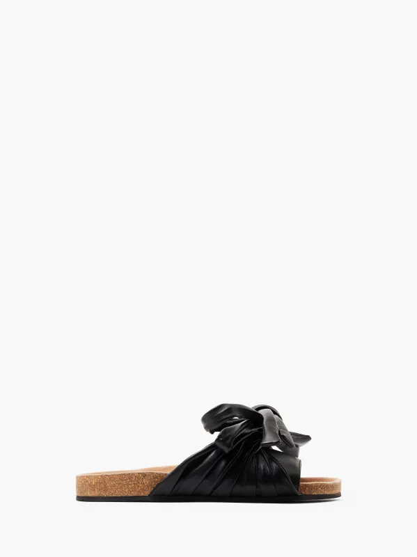 BOW FLAT SANDALS sold by J.W. Anderson