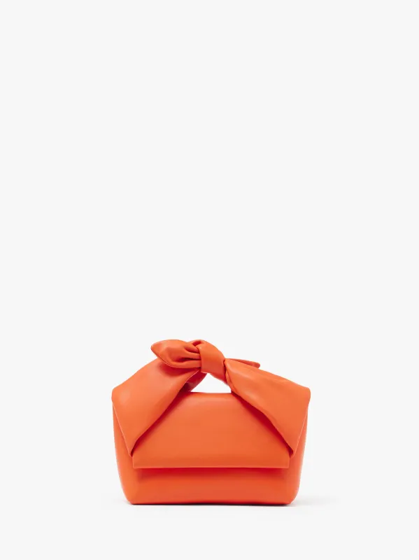 MEDIUM BOW TWISTER - LEATHER TOP HANDLE BAG made by J.W. Anderson