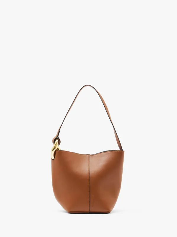 SMALL JWA CORNER BUCKET - LEATHER BUCKET BAG sold by J.W. Anderson