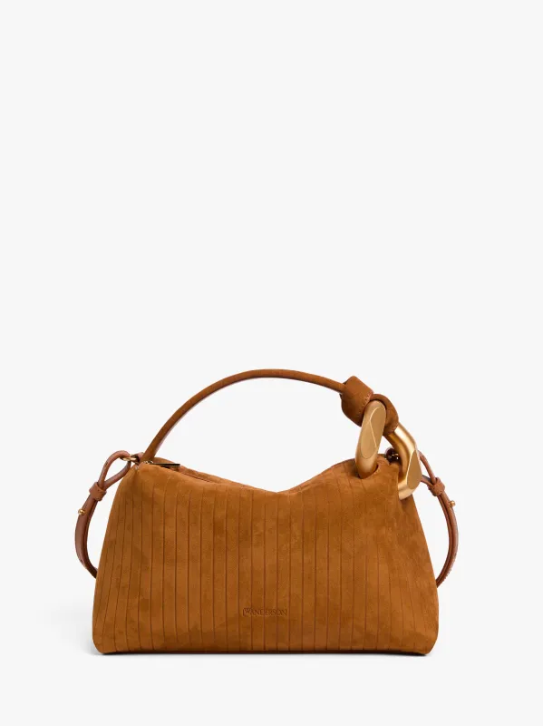 JWA CORNER BAG - SUEDE TOP HANDLE BAG sold by J.W. Anderson