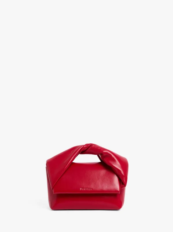 MEDIUM TWISTER - LEATHER TOP HANDLE BAG sold by J.W. Anderson