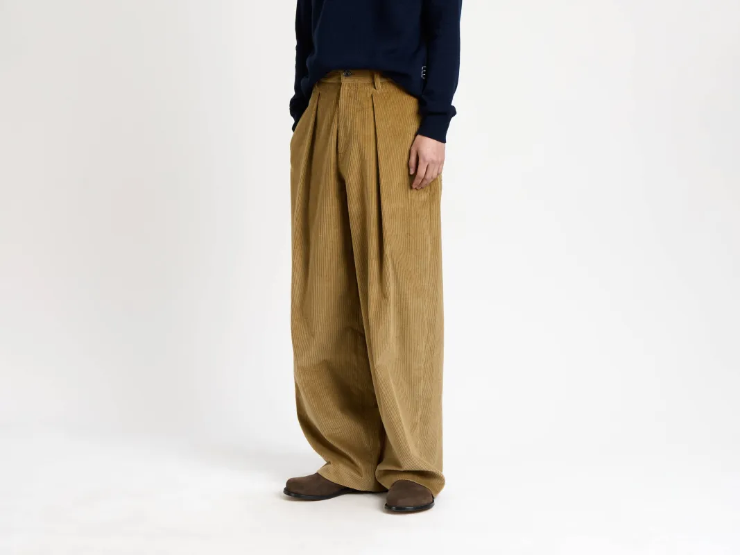 MENS SINGLE PLEAT TROUSERS IN BISCUIT sold by J.W. Anderson