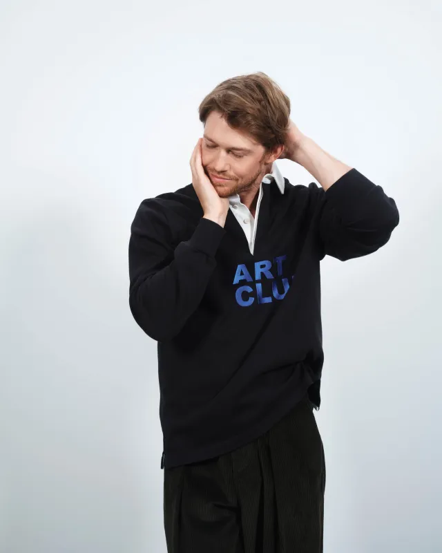 'ART CLUB' RUGBY POLO TOP IN WASHED BLACK sold by J.W. Anderson