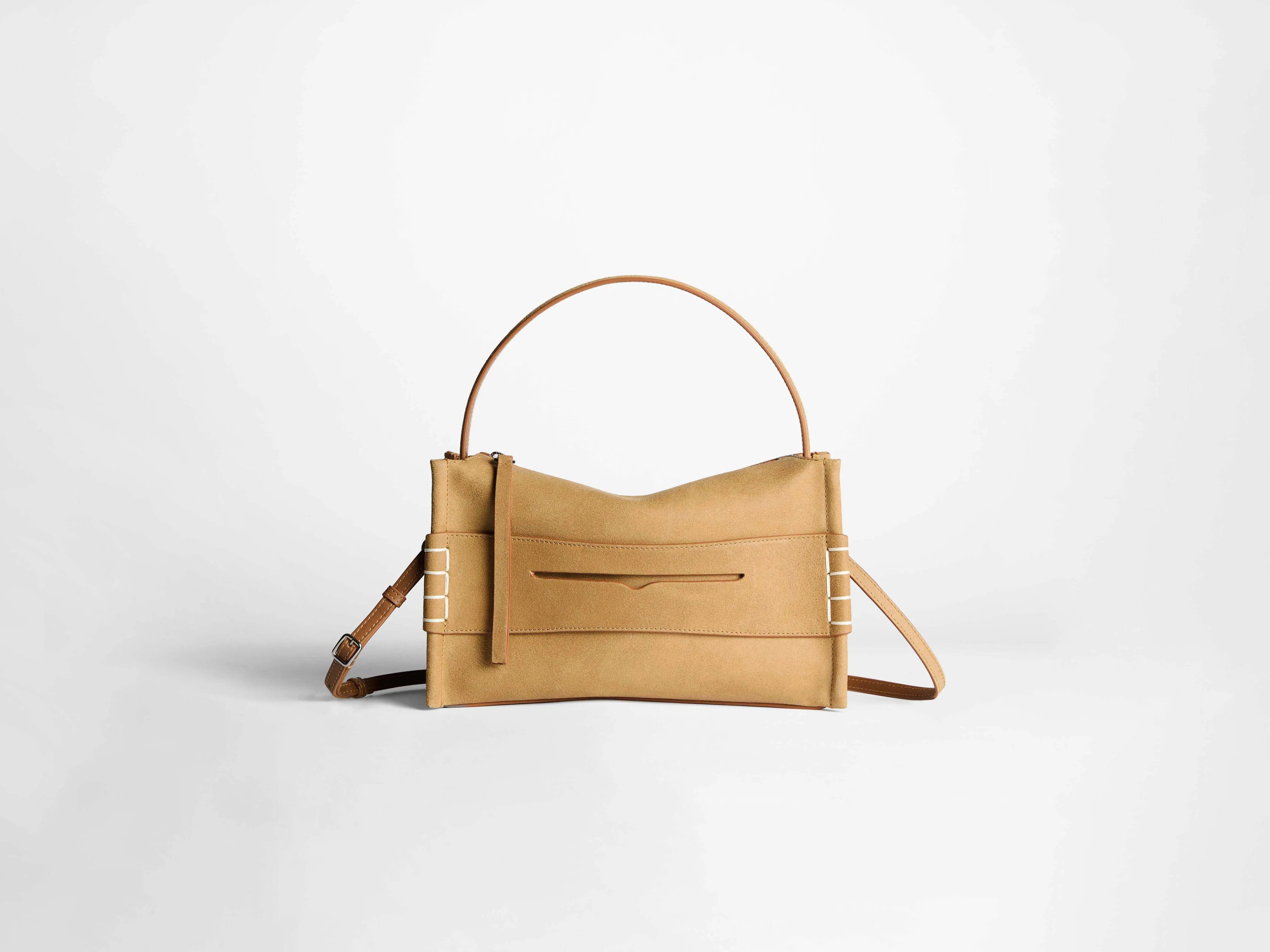 LOAFER BAG IN GOLD IN WAXED SUEDE sold by J.W. Anderson