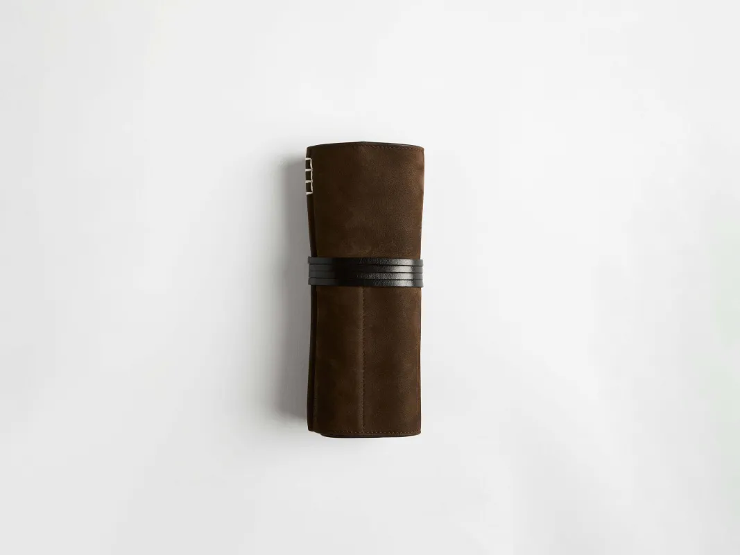 LEATHER PEN-ROLL CASE IN DARK BROWN made by J.W. Anderson