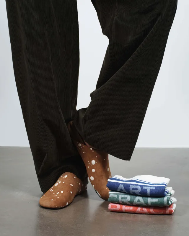 MENS SLIPPER MULES IN TAN & CREAM sold by J.W. Anderson
