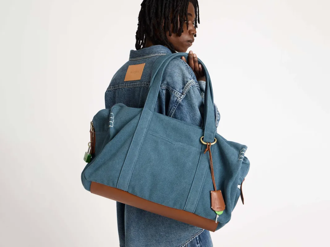 WEEKENDER CANVAS TOTE BAG IN MID-BLUE sold by J.W. Anderson