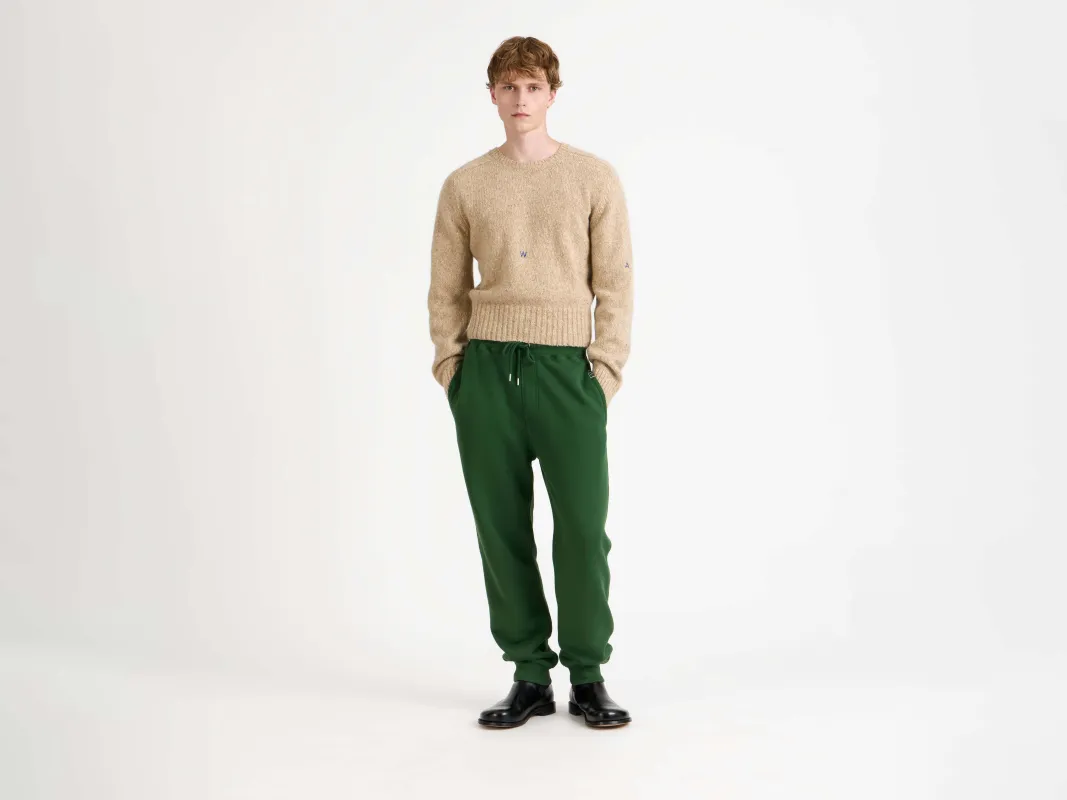 CUFFED SWEATPANTS IN GREEN sold by J.W. Anderson