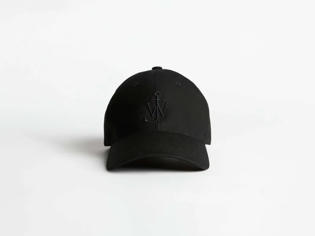 WAXED COTTON BASEBALL CAP IN BLACK sold by J.W. Anderson