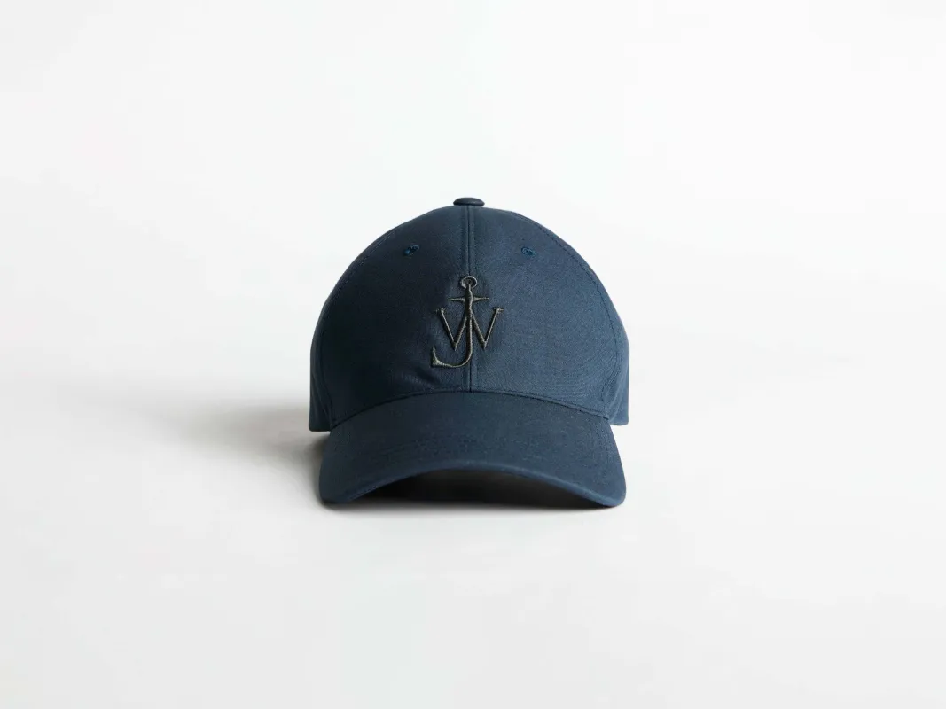 WAXED COTTON BASEBALL CAP IN DARK BLUE sold by J.W. Anderson
