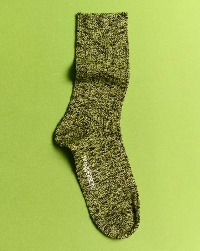 COTTON SLUB SOCK IN BLACK AND GREEN sold by J.W. Anderson