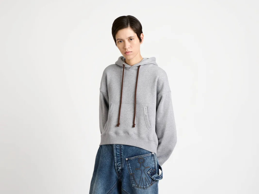 WOMENS CURVED HEM HOODIE IN MID GREY MELANGE sold by J.W. Anderson