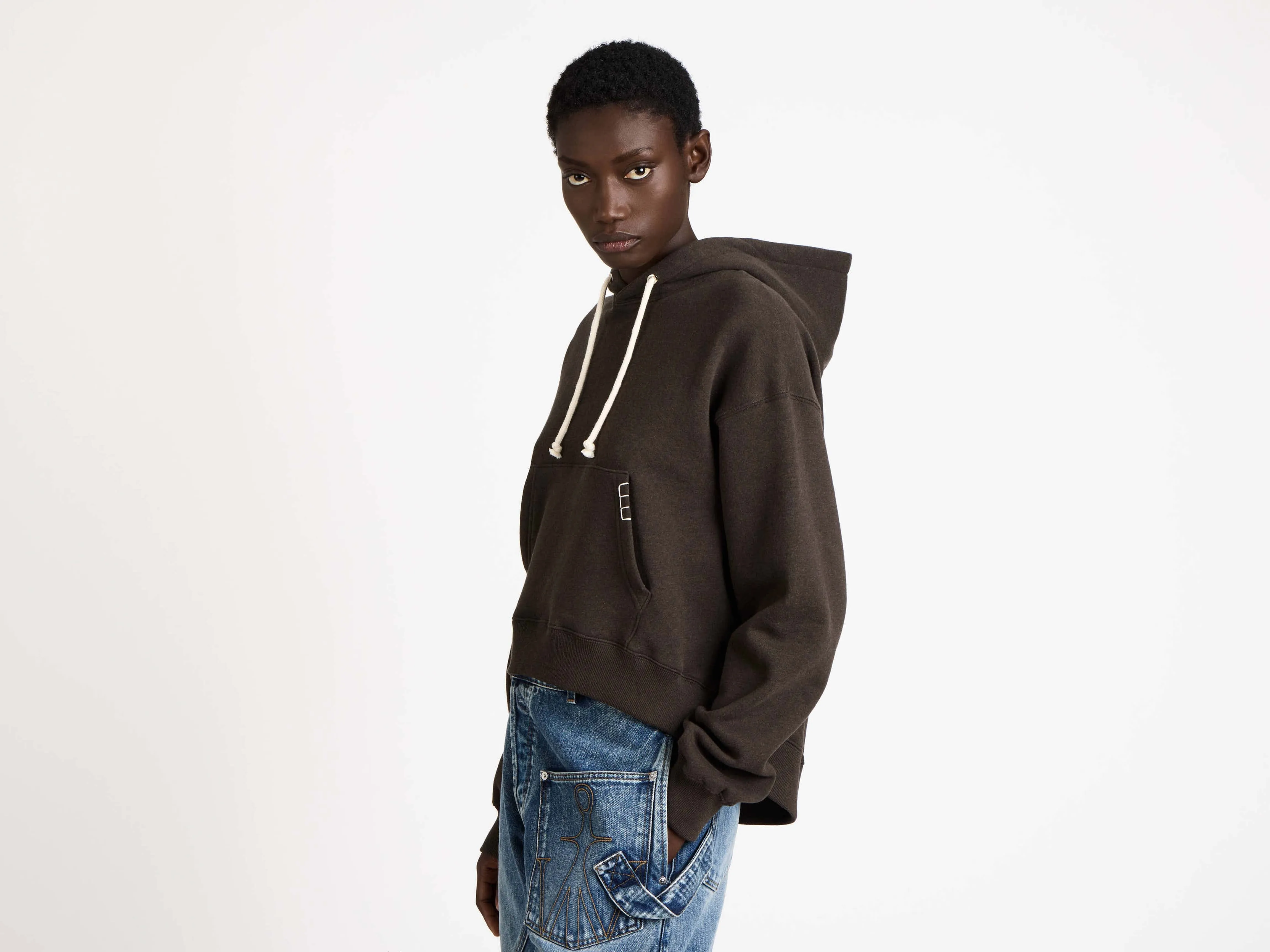 WOMENS CURVED HEM HOODIE IN DARK BROWN MELANGE sold by J.W. Anderson