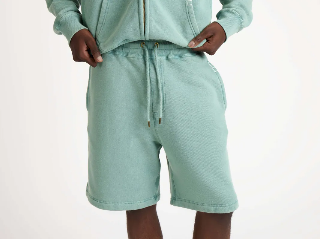 MENS DRAWSTRING SHORTS IN WASHED TEAL made by J.W. Anderson