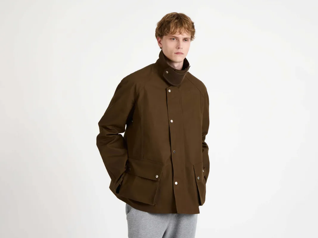 MENS RAGLAN SLEEVE OUTDOOR JACKET IN DARK OLIVE made by J.W. Anderson