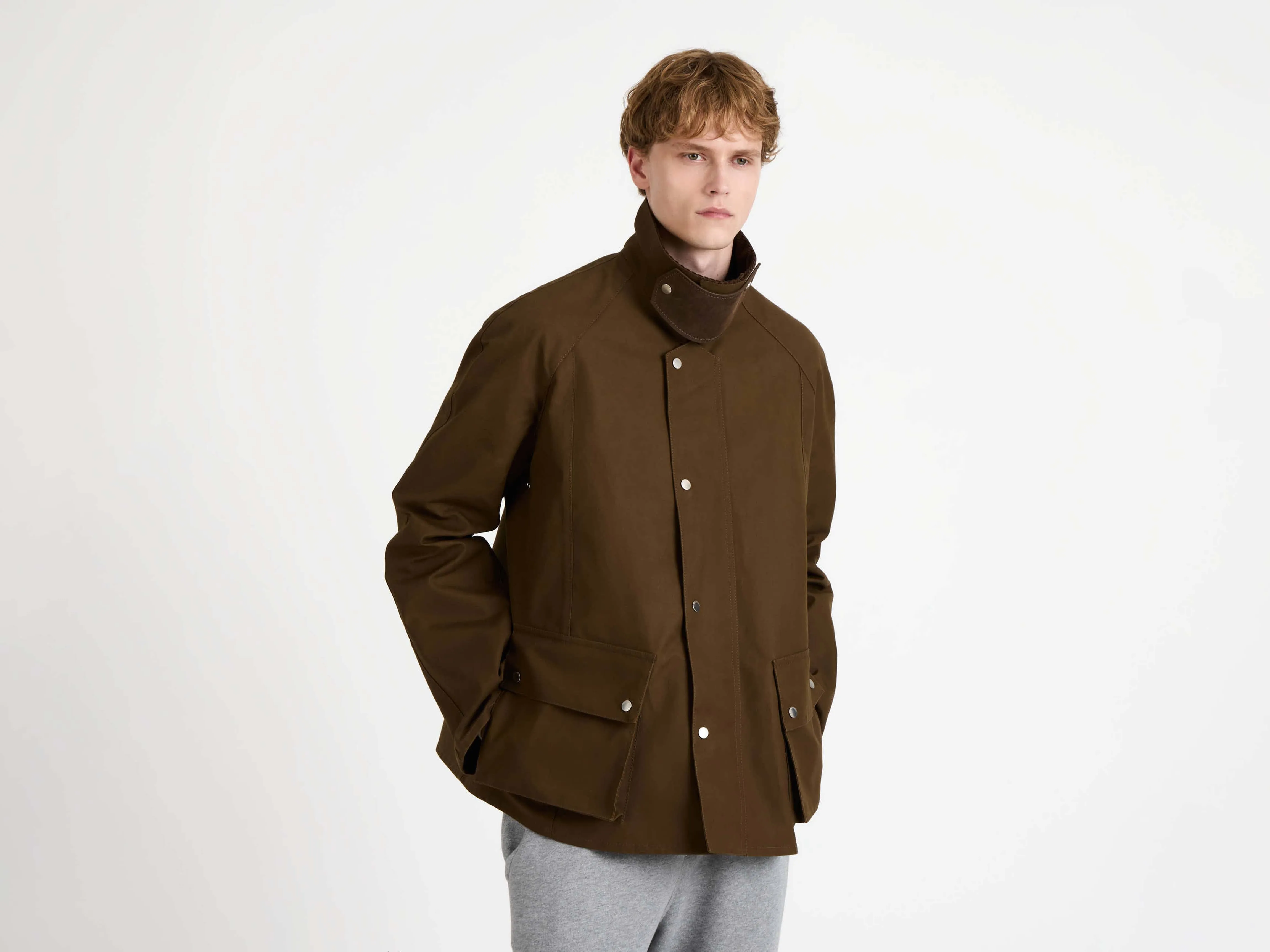 MENS RAGLAN SLEEVE OUTDOOR JACKET IN DARK OLIVE sold by J.W. Anderson