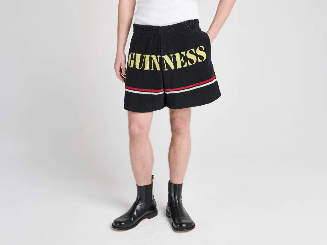 Unisex JW ANDERSON X GUINNESS TOWELLING SHORTS IN BLACK made by J.W. Anderson