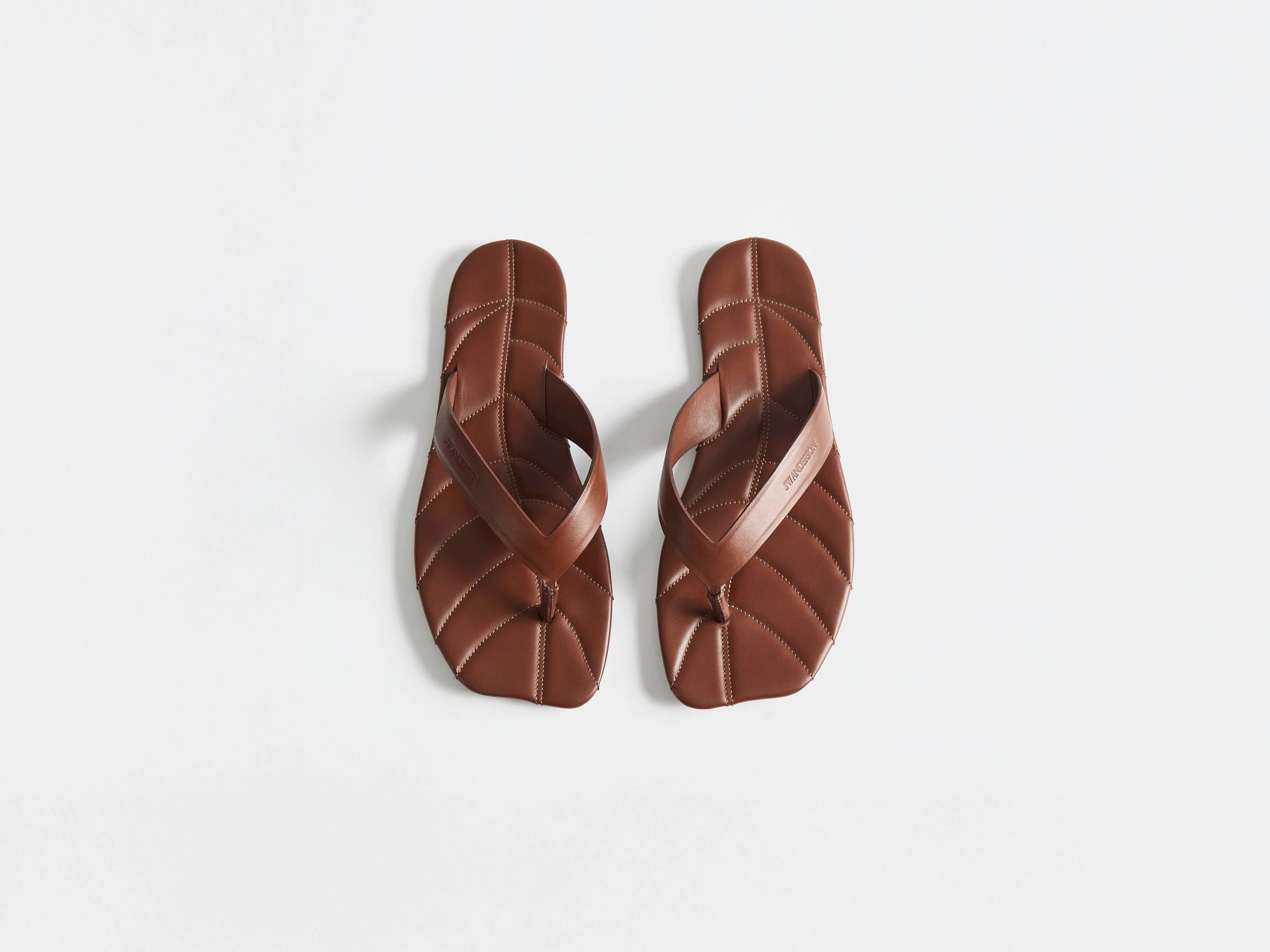 WOMENS LEATHER LEAF SLIDES IN BROWN sold by J.W. Anderson