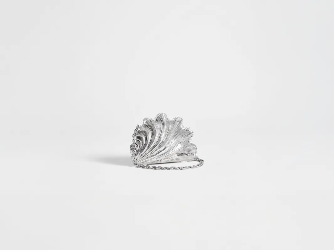 SHELL CLUTCH IN VINTAGE SILVER made by J.W. Anderson