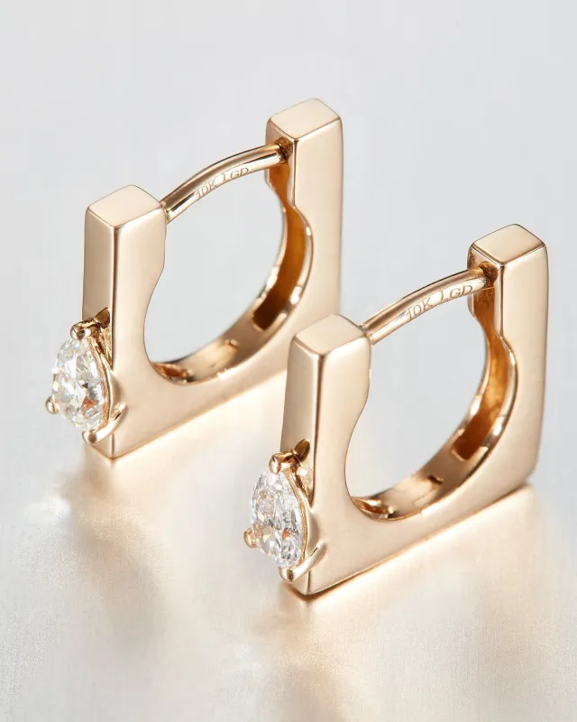 10K Pear Cut Diamond Huggie Earrings made by JENNY BIRD
