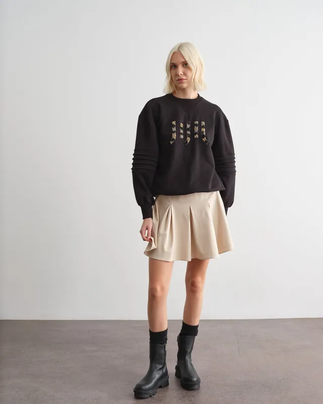 Minigonna a pieghe in tinta unita sold by Jijil