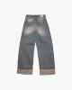 Pantalone in denim a gamba larga sold by Jijil