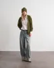 Pantalone in denim a gamba larga sold by Jijil